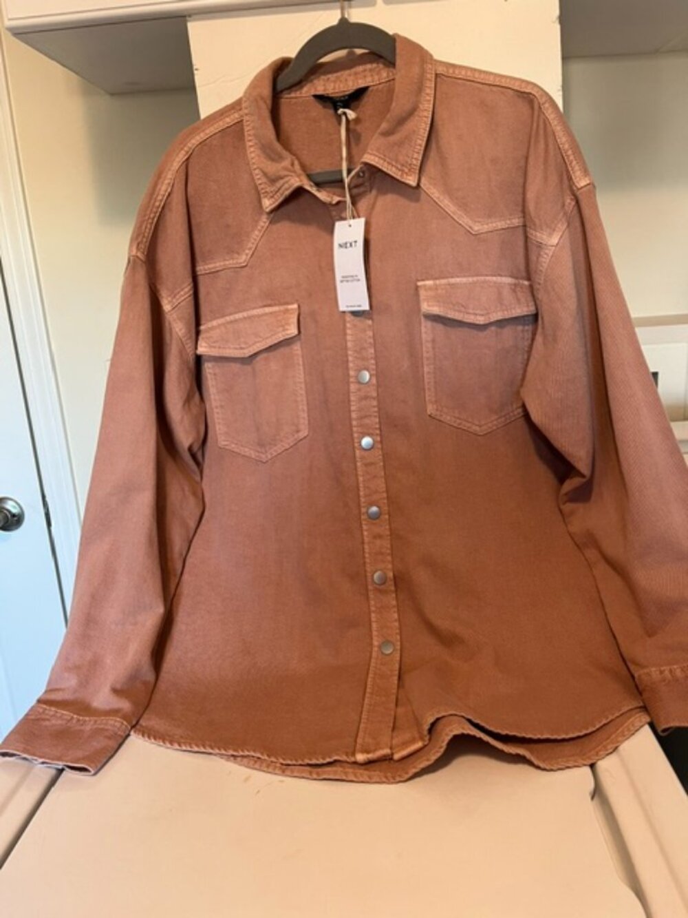 Next oversized pink cotton shirt jacket.